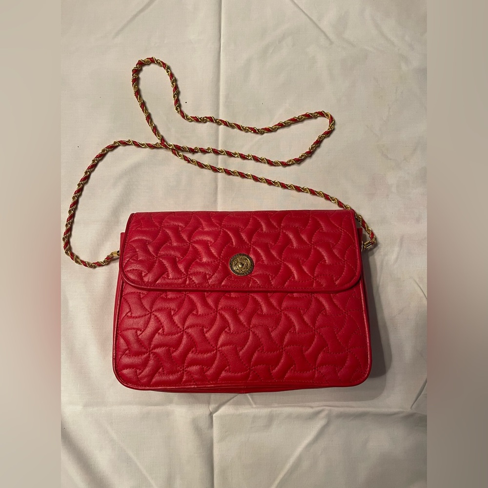 Balmain red leather, with chain and leather strap.